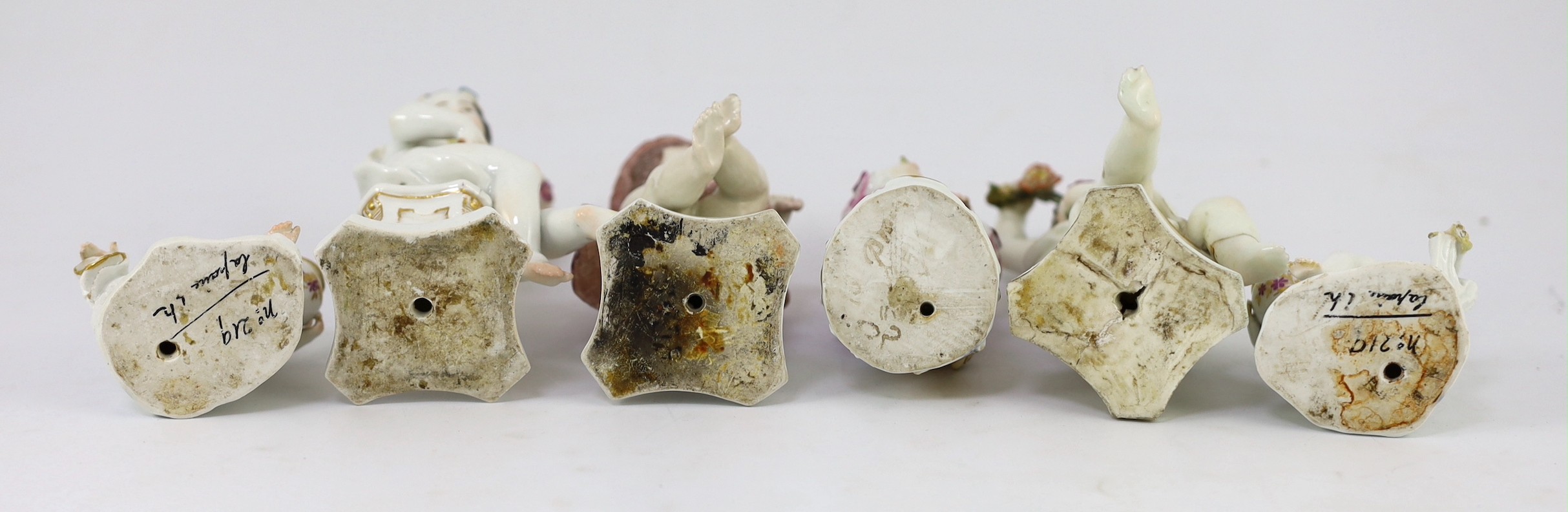 Six Meissen porcelain figures of putti and a boy, second half 18th century, 8.5cm - 14.5cm high, restorations